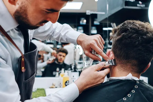 A clipper fade in progress