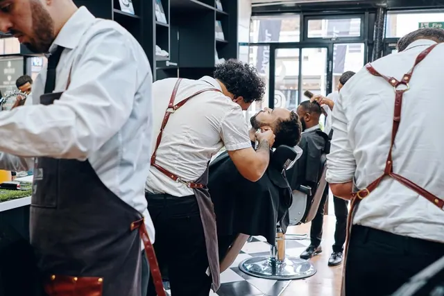 Barbers at work on the shop floor