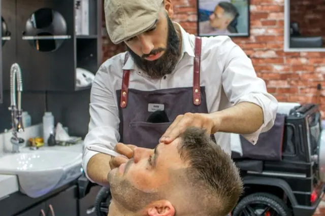 A hot towel shave in progress