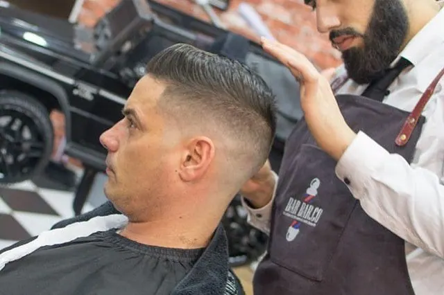 A side part with a skin fade