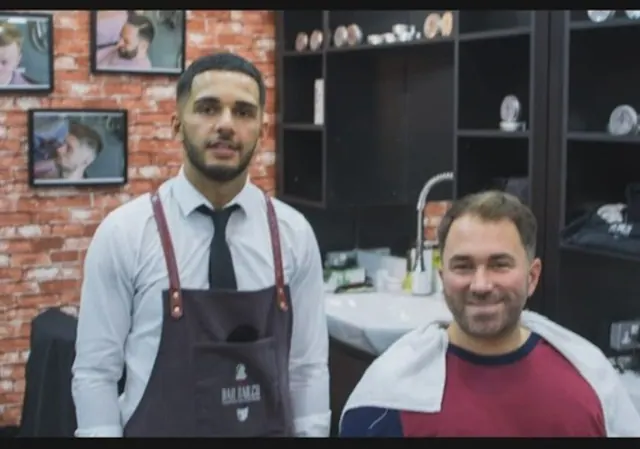 A barber and a client after a cut